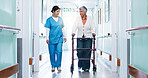 Nurse, physiotherapy and woman in hospital with walker, checkup and help for stroke rehabilitation. Worker, support and mature person in clinic hallway with mobility aid, physical therapy or healing.