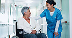 Conversation, nurse and senior woman in wheelchair at hospital for consultation, healthcare or support. Happy, caregiver and elderly person with disability for medical checkup in clinic corridor.