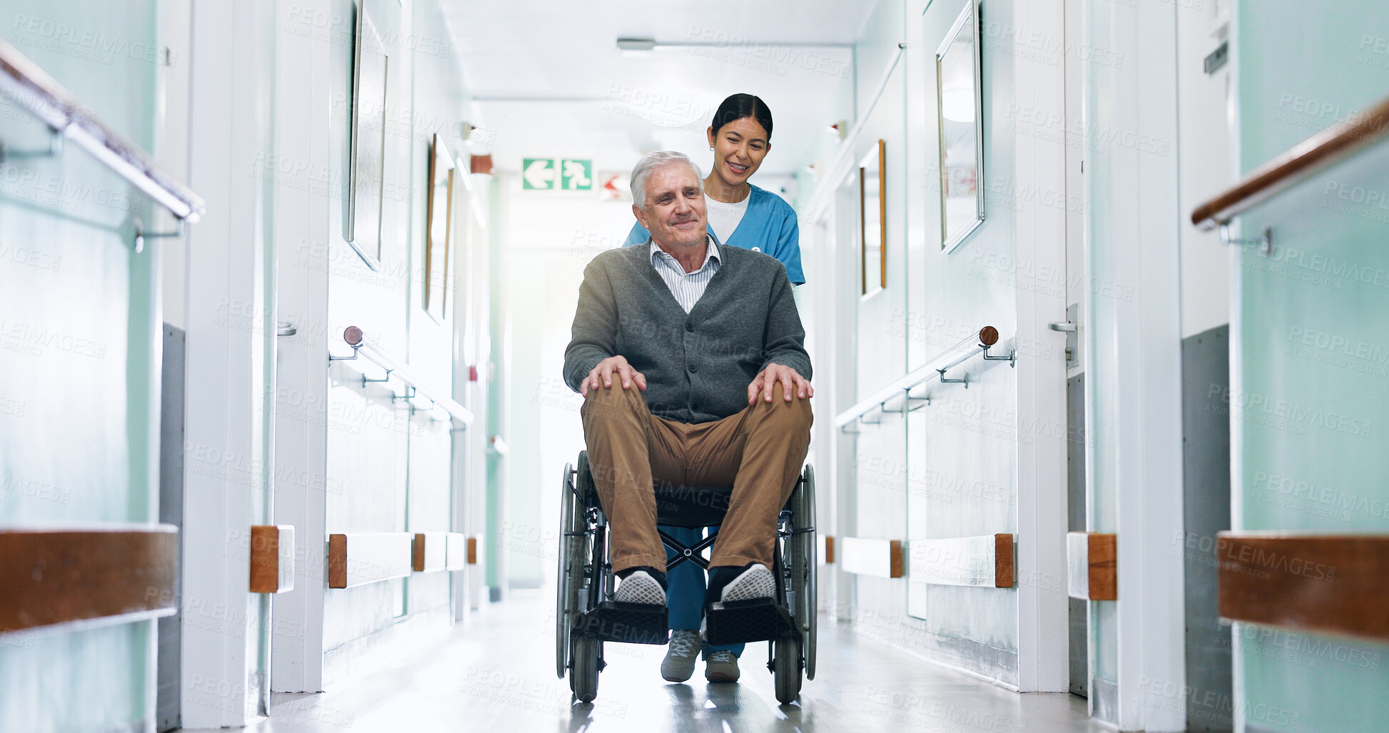 Buy stock photo Push, wheelchair and nurse in hospital with old man, medical assistance and happy for rehabilitation. Healthcare worker, smile and senior person with disability, healing or wellness in clinic hallway