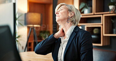 Buy stock photo Mature, businesswoman and neck pain in office with computer, burnout and fatigue from accounting job. Tired, person and accountant in firm with desktop, bad posture and inflammation from work stress.