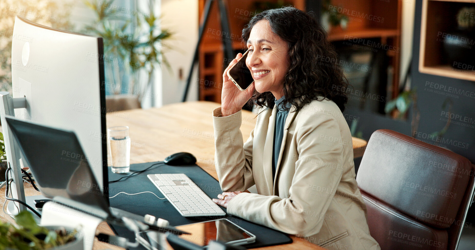Buy stock photo Woman, phone call and review in office with computer, research and buyer approval for real estate. Mature realtor, mobile and smile in workplace with tech, positive feedback and auction negotiation