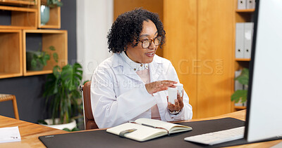 Buy stock photo Doctor, pills and video call in clinic with computer, advice or communication for prescription drugs. Happy, mature woman or medical worker talk with pc, online meeting and instructions for medicine.