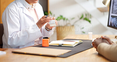 Buy stock photo Doctor, patient and hands in appointment with pills, instructions and advice for prescription drugs. Healthcare worker, people and help in clinic with medicine, consultation and how to cure illness.