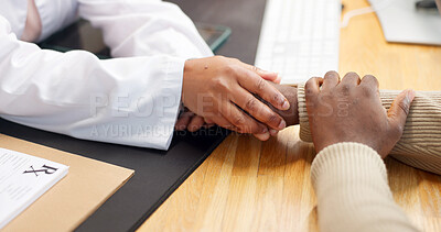 Buy stock photo Doctor, patient and holding hands in office with empathy, bad news or assurance for disease recovery. Healthcare worker, people and console in clinic with diagnosis, compassion and emotional support.