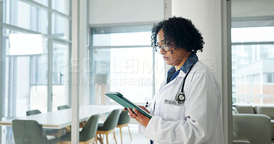 Buy stock photo Healthcare, doctor and serious woman with tablet, reading assessment report and admin email. Research, hospital and mature person with tech to review diagnosis update, test info or medical records