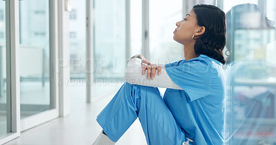 Buy stock photo Thinking woman, stress or nurse in hospital with medical burnout, fatigue or worry for malpractice. Reflection, tired person or healthcare worker on floor with ethical concern, shift pressure or fail