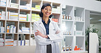 Portrait, chemist and happy woman in pharmacy with arms crossed, healthcare career and experience. Pharmacist, smile and female person in drugstore with confidence, about us or knowledge of medicine.