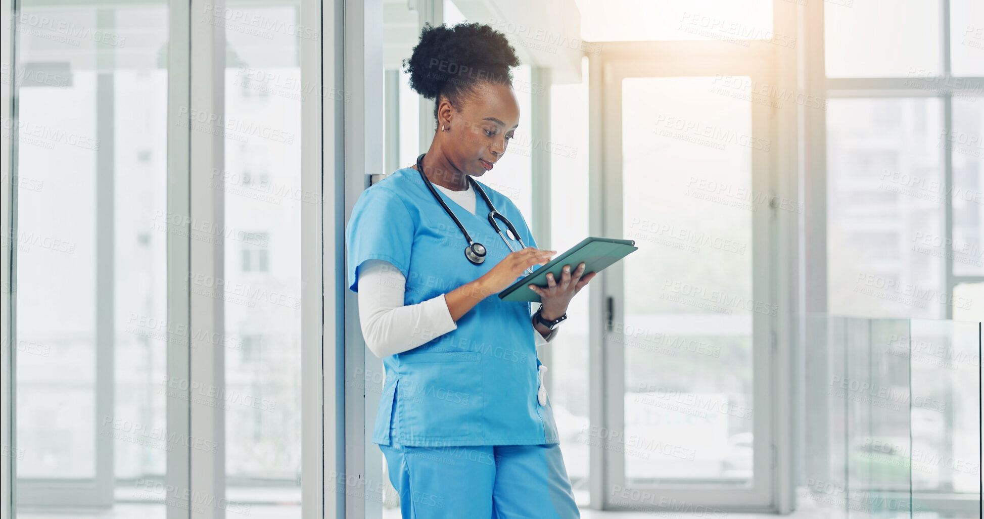 Buy stock photo Healthcare, nurse and woman with tablet in hospital, research and reading treatment plan on website. Clinic, medical professional and black person with technology, online and scroll diagnosis on app
