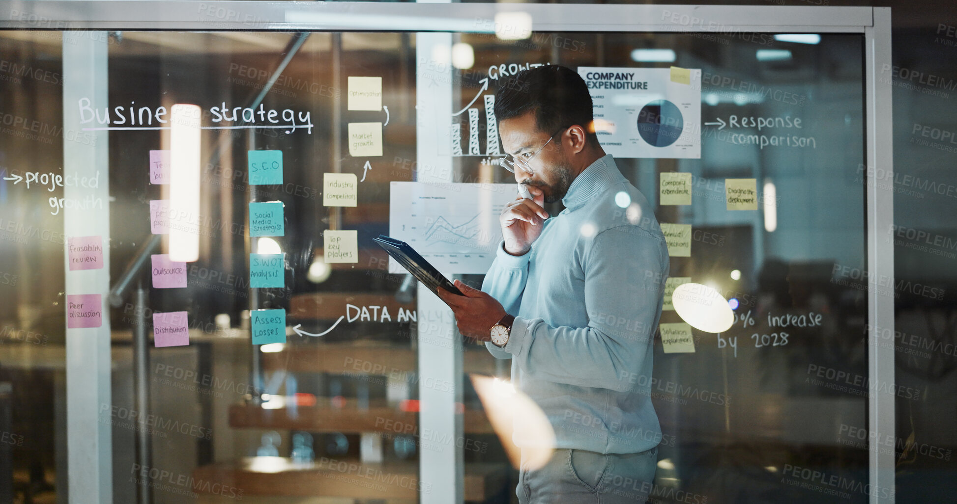 Buy stock photo Thinking, business and man on tablet by window for finance review, budget planning and research. Night, tech and person with sticky notes for profit growth, solution and financial strategy in office