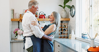 Buy stock photo Dance, cooking and love with old couple in kitchen for bonding, romantic gesture and meal prep. Connection, support and food with senior man and woman in home for retirement, movement and recipe