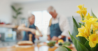 Buy stock photo Old couple, cooking and kitchen at house with flowers, blossom and romance for breakfast. Senior people, helping and floral bouquet in home with meal prep, blooming season and household decoration