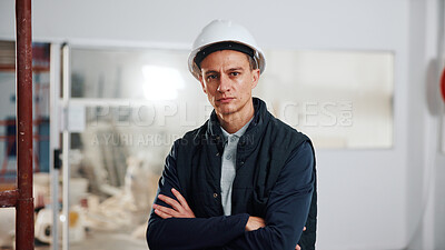 Buy stock photo Portrait, man and serious with arms crossed for construction, renovation or site supervision. PPE, about us or project manager on worksite for quality control, industry expertise or building foreman