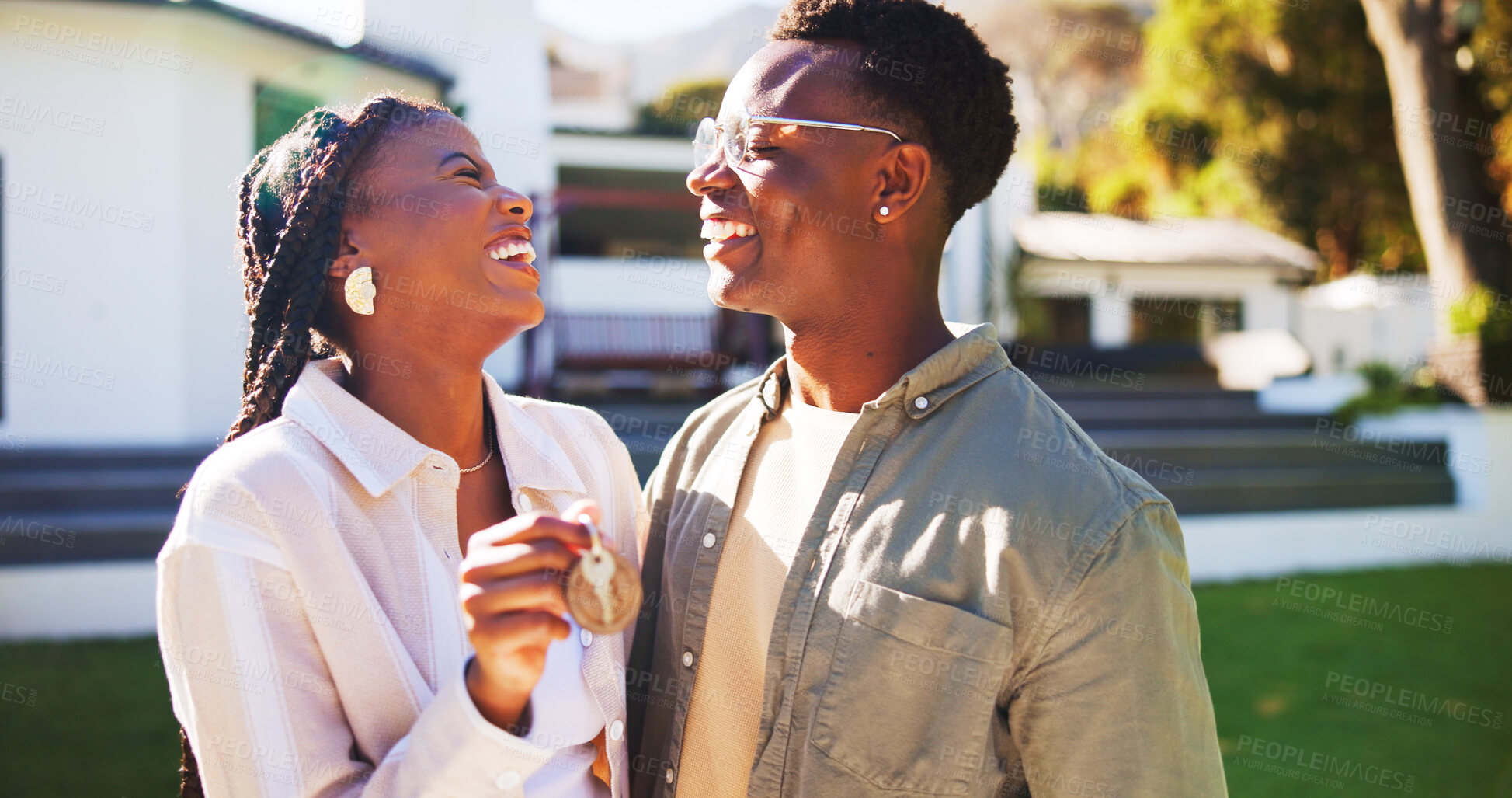 Buy stock photo Outdoor, key and happy couple moving in house with new beginnings, real estate goals and milestone. Black people, dating and smile in backyard with keyring, relationship and relocation to dream home.