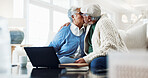 Kiss, laptop and senior couple on home sofa with document for pension payout, online or retirement. Man, woman or love in house with self service app, policy and fund benefit or old age grant on tech