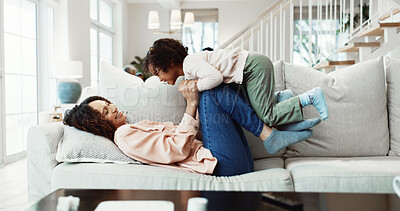 Buy stock photo Fun, mom or girl on sofa with lifting, happy relationship or bonding together in child growth. Childcare, laugh or family in home with carry, parenthood or playful connection in childhood development