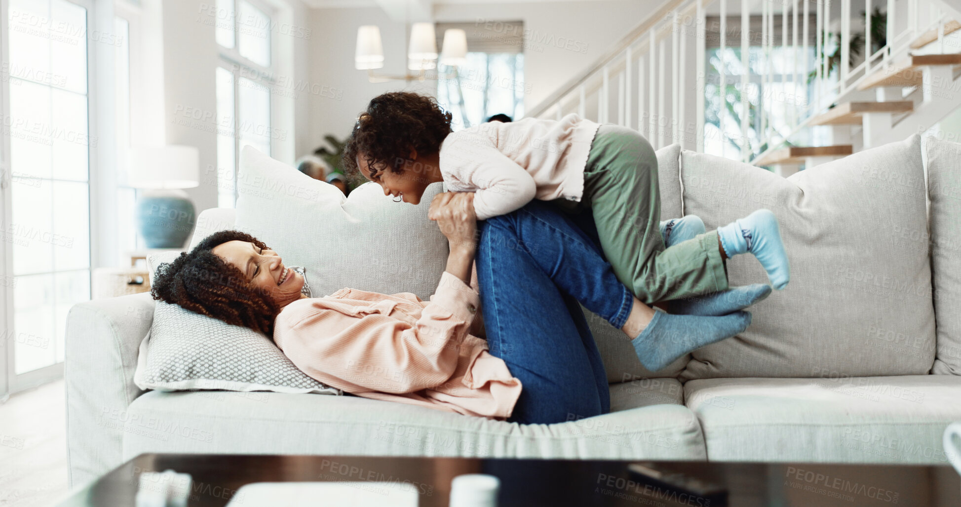 Buy stock photo Fun, mom or girl on sofa with lifting, happy relationship or bonding together in child growth. Childcare, laugh or family in home with carry, parenthood or playful connection in childhood development
