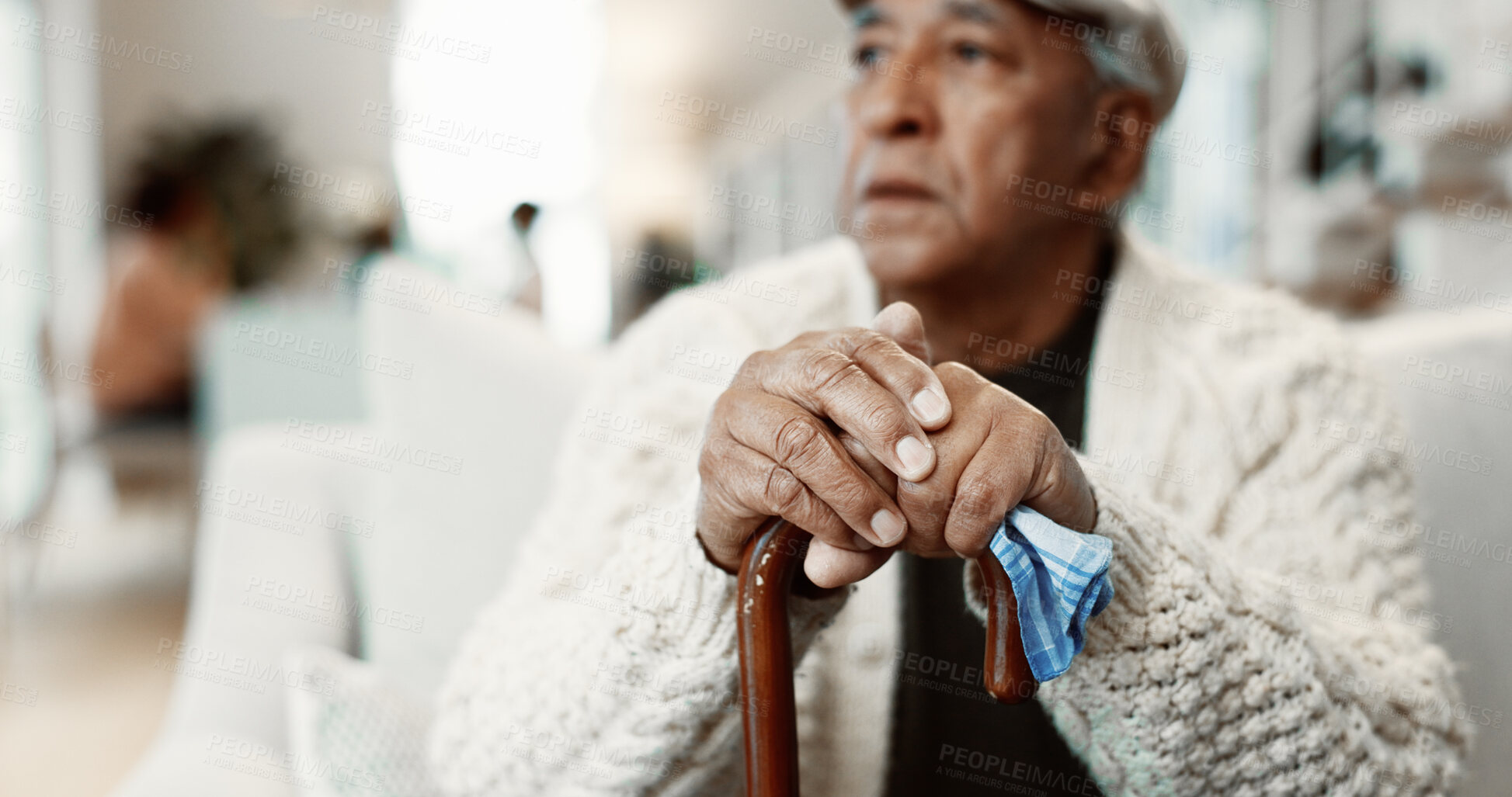 Buy stock photo Thinking, walking stick and hands of senior man on sofa in home with reminder of retirement. Serious, wooden cane and elderly person with disability in living room for pension in apartment on weekend