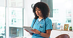 Medical, review and woman in hospital with tablet, research and patient diagnosis in telehealth. Healthcare, reading or doctor in clinic with tech, online consulting or case report for treatment plan