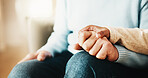 Old couple, support and holding hands with partner in house, retirement and relationship commitment. Marriage, solidarity and senior people on break, physical touch and comfort with love in home