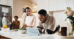 Man, tablet and big family in kitchen for cooking, meal prep and prepare food for bonding in home. Generations, happy people and guide for online recipe, conversation and connection for holiday