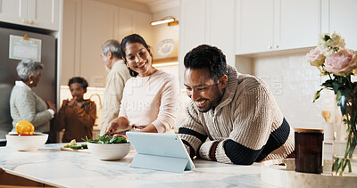 Buy stock photo Man, tablet and big family in kitchen for cooking, meal prep and prepare food for bonding in home. Generations, happy people and guide for online recipe, conversation and connection for holiday