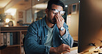 Night, man and eye strain in office with computer, wrong glasses prescription or stress for deadline. Late, tired person and headache in business with desktop, overtime work and fatigue from burnout.