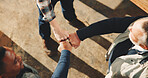 Carpenter, hands and fist bump with team in workshop, solidarity or motivation for furniture project. Carpentry, support and collaboration with people in factory, above and agreement with gesture