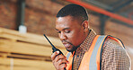 Black man, carpenter and talk in workshop with radio, discussion and schedule for timber delivery. Thinking, person or chat with tech in warehouse for carpentry, instructions and furniture production