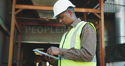 Buy stock photo Architect, research and man with tablet on construction site, scroll and plan for renovation on web. Serious, civil engineer and black person with technology, reading and property development on app