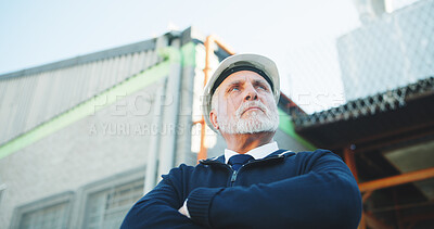 Buy stock photo Construction, thinking or man with arms crossed, progress reflection or evaluation of building site. Below, ppe or mature engineer with review, project perspective or operation plan for development.