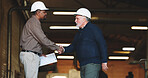 Construction, handshake or men with safety inspection, building deal or approval in site check. Industrial, equipment or engineers with shaking hands, partnership agreement or clearance in compliance