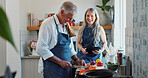 Cooking, tablet and old couple in kitchen with recipe, food blog and connection with meal prep. Smile, help and elderly people in home with tech, online instructions and bonding in culinary hobby.