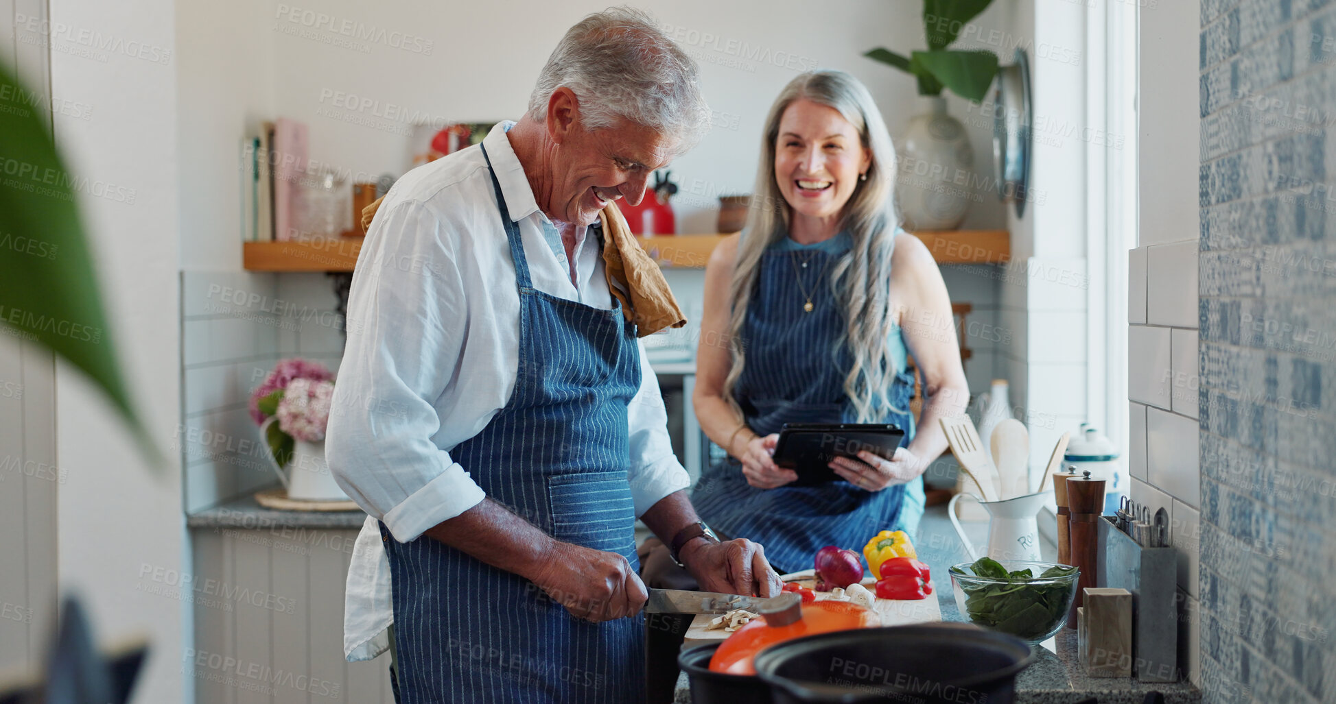 Buy stock photo Cooking, tablet and old couple in kitchen with recipe, food blog and connection with meal prep. Smile, help and elderly people in home with tech, online instructions and bonding in culinary hobby.