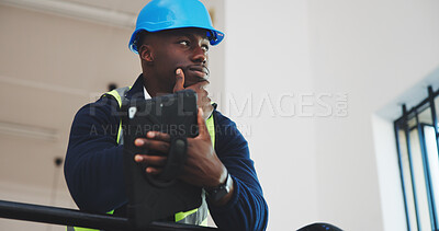 Buy stock photo Architect, thinking and black man with tablet in building for construction safety or security. Thoughtful, male person or civil engineer with technology for industrial renovation or improvement