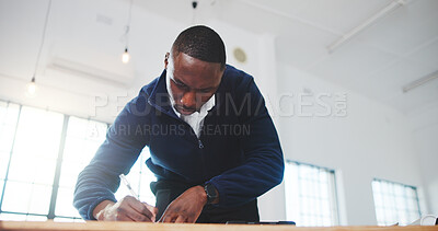 Buy stock photo Architect, writing and black man in office with plan, design review and draft of renovation project. Development, below and engineer with notes, progress checklist and strategy brief for remodeling.