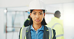Portrait, engineer and woman at construction site with helmet, building safety or remodeling project. Serious, person and property developer with PPE, renovation and pride for engineering expertise.