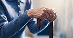 Senior, person and hands with cane in retirement home for balance, support or medical aid. Elderly, patient or pensioner with walking stick for healthcare comfort, assistance or help in nursing house