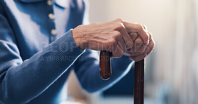 Buy stock photo Senior, person and hands with cane in retirement home for balance, support or medical aid. Elderly, patient or pensioner with walking stick for healthcare comfort, assistance or help in nursing house