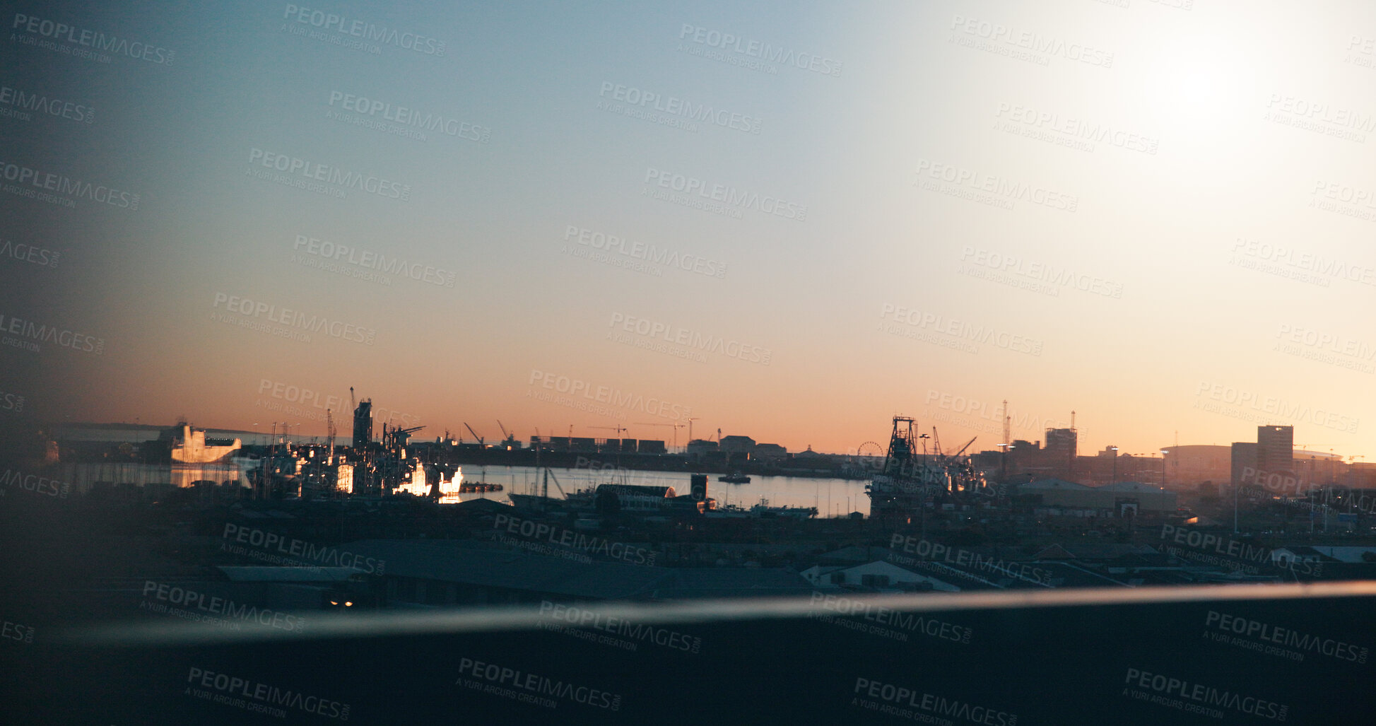Buy stock photo Ocean, sunset and port in city with ships, buildings or maritime transport for global trade industry. Space, boats and cargo vessel outdoor by sea with dock, international courier and freight export.