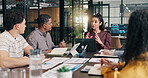 Businesswoman, talking and meeting with laptop in boardroom, team and risk management with research. People, ideas and collaboration with tech, data analysis and discussion with colleagues in office