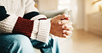 Nervous, hands and man with anxiety on couch for stress, trauma processing or PTSD therapy. Sofa, counseling and person waiting with worry for pressure, mental health or psychology patient at office