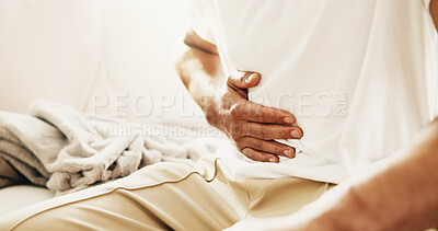 Buy stock photo Man, hands and sick on sofa with stomach ache, allergy or constipation from irritable bowel syndrome. Person, abdomen pain and cramps in house with indigestion, disease and gas from bloating problem.