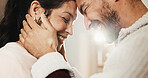 Forehead, touch and happy couple in home, love and bonding with partner on break or marriage loyalty. House, flare and connection with spouse, relationship commitment and people with smile on weekend