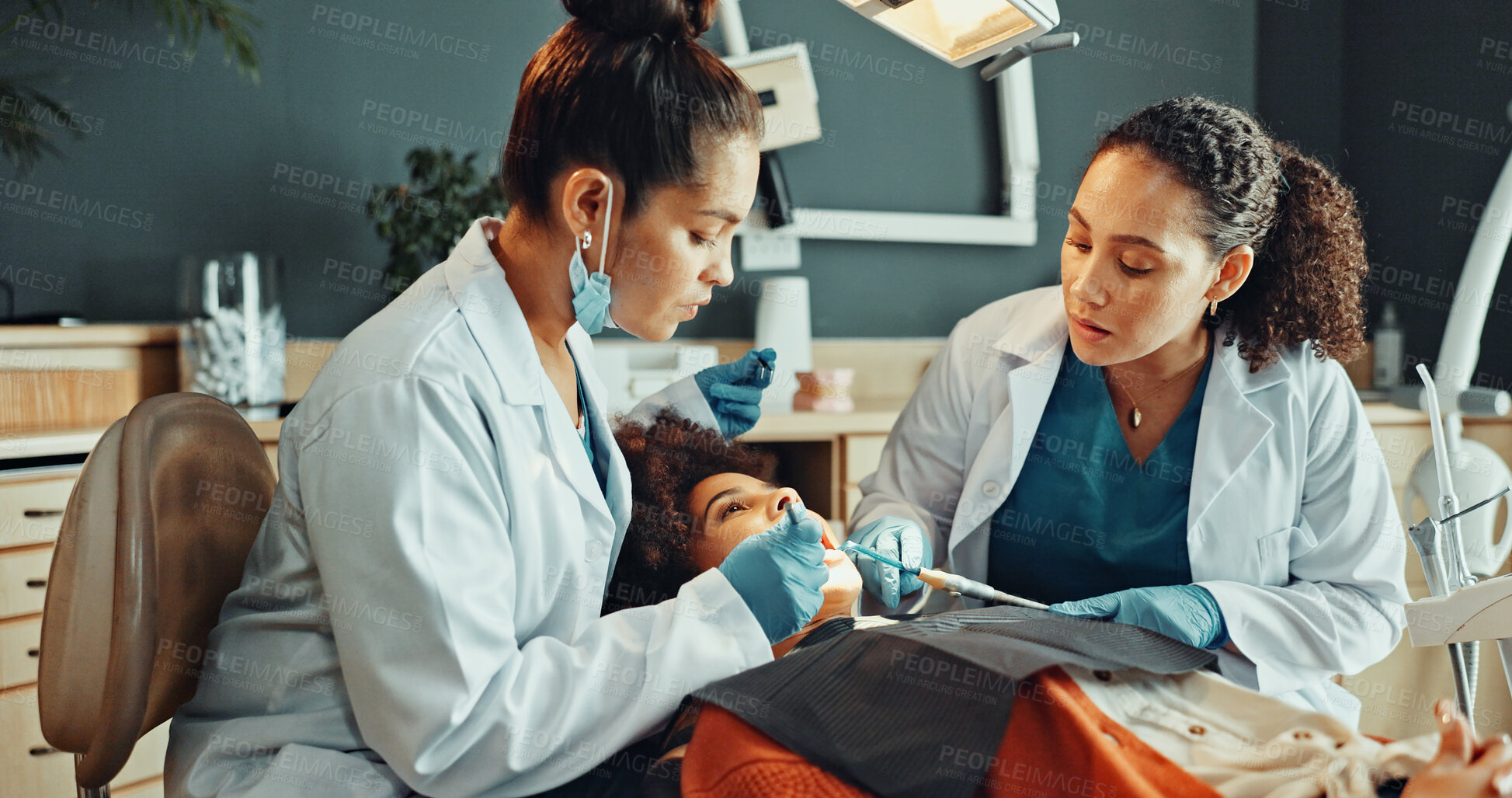 Buy stock photo Dental, help or patient with dentist for cleaning, cavity or gum disease in consultation for health. Orthodontist, assistant and women for teeth whitening, oral care or treatment for mouth procedure
