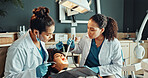 Dental, tools or patient with dentist for cleaning, cavity or gum disease in consultation for help. Orthodontist, assistant and women for teeth whitening, oral care or treatment for mouth procedure