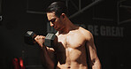 Exercise, gym and bodybuilder man with dumbbells or weights for training, muscle growth and self care. Iron, workout and person with health club membership for fitness, strong arms and wellness