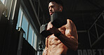 Fitness, thinking and man exercise with music and serious for training, muscle and self care. Earphones, workout playlist and person or health club membership for bodybuilding, strong and wellness