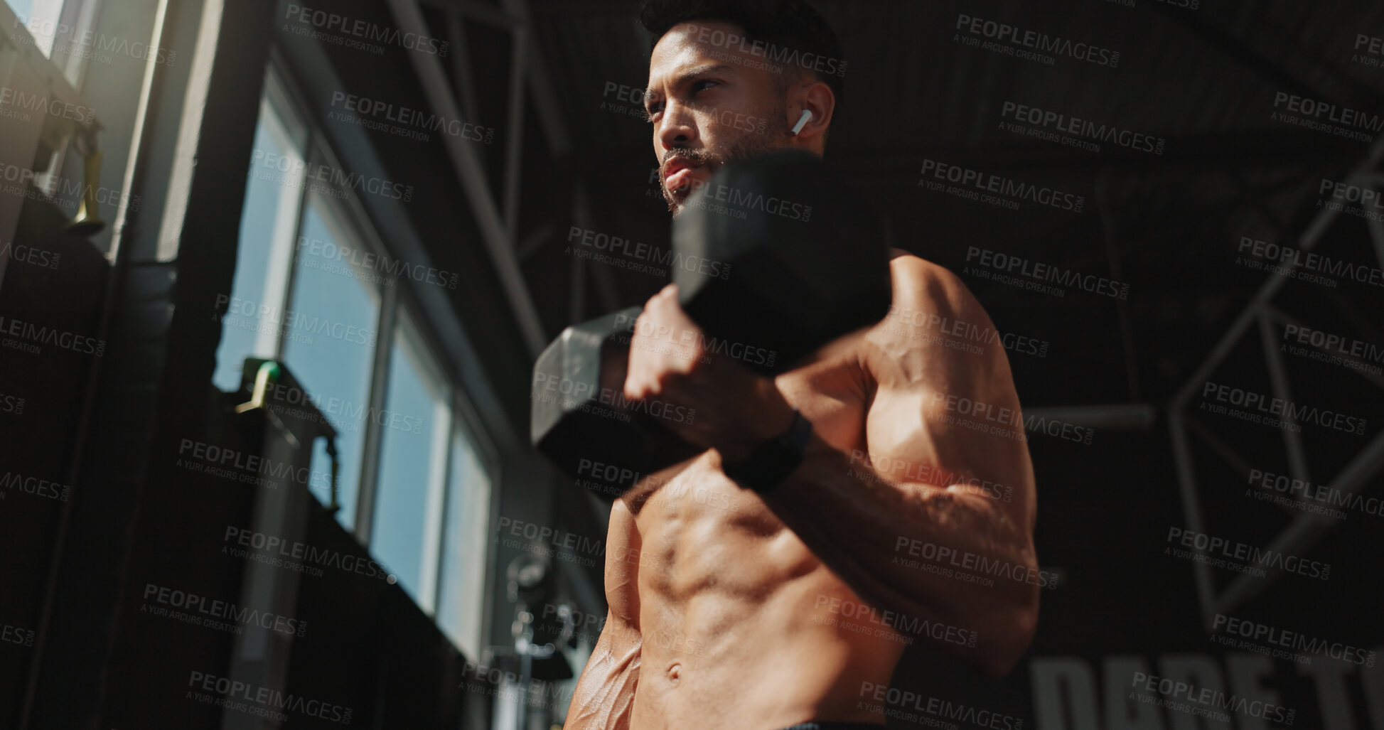 Buy stock photo Fitness, thinking and man exercise with music and serious for training, muscle and self care. Earphones, workout playlist and person or health club membership for bodybuilding, strong and wellness