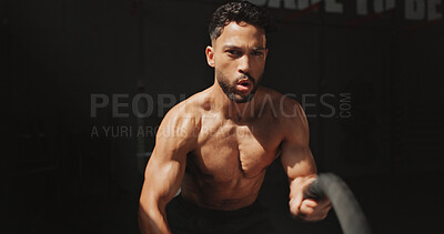 Buy stock photo Fitness, man and battle rope in gym for strength training, indoor workout or intense exercise. Active, male person or sweat with muscular athlete with cable for endurance or power in health club