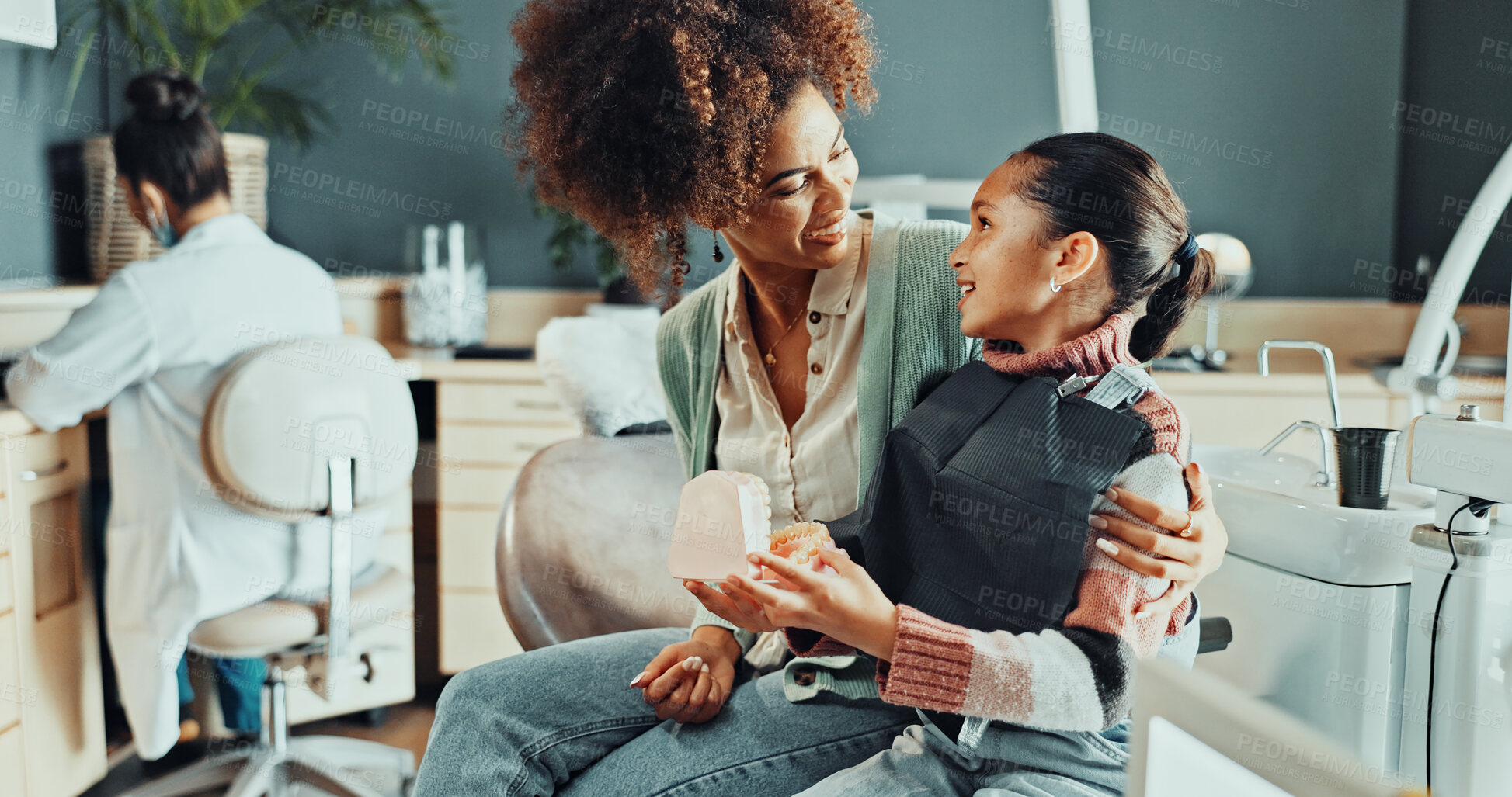 Buy stock photo Mom, child and appointment with exam in dentist for dental hygiene, support or teeth whitening. Mother, daughter or smile with comfort for oral healthcare, medical insurance or gum care in clinic